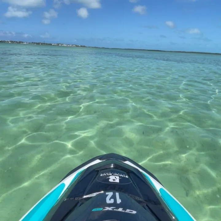 Jet ski running across the turquoise flats