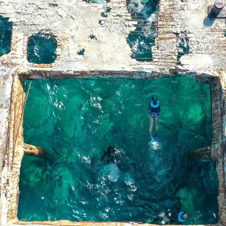 Aerial view of a snorkeler above the sunken SS Sapona shipwreck off Bimini