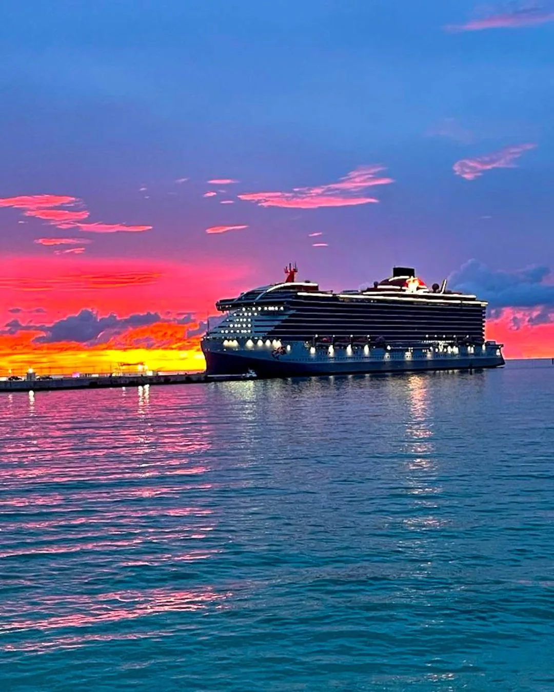 Virgin Voyages at anchor off Bimini at dusk
